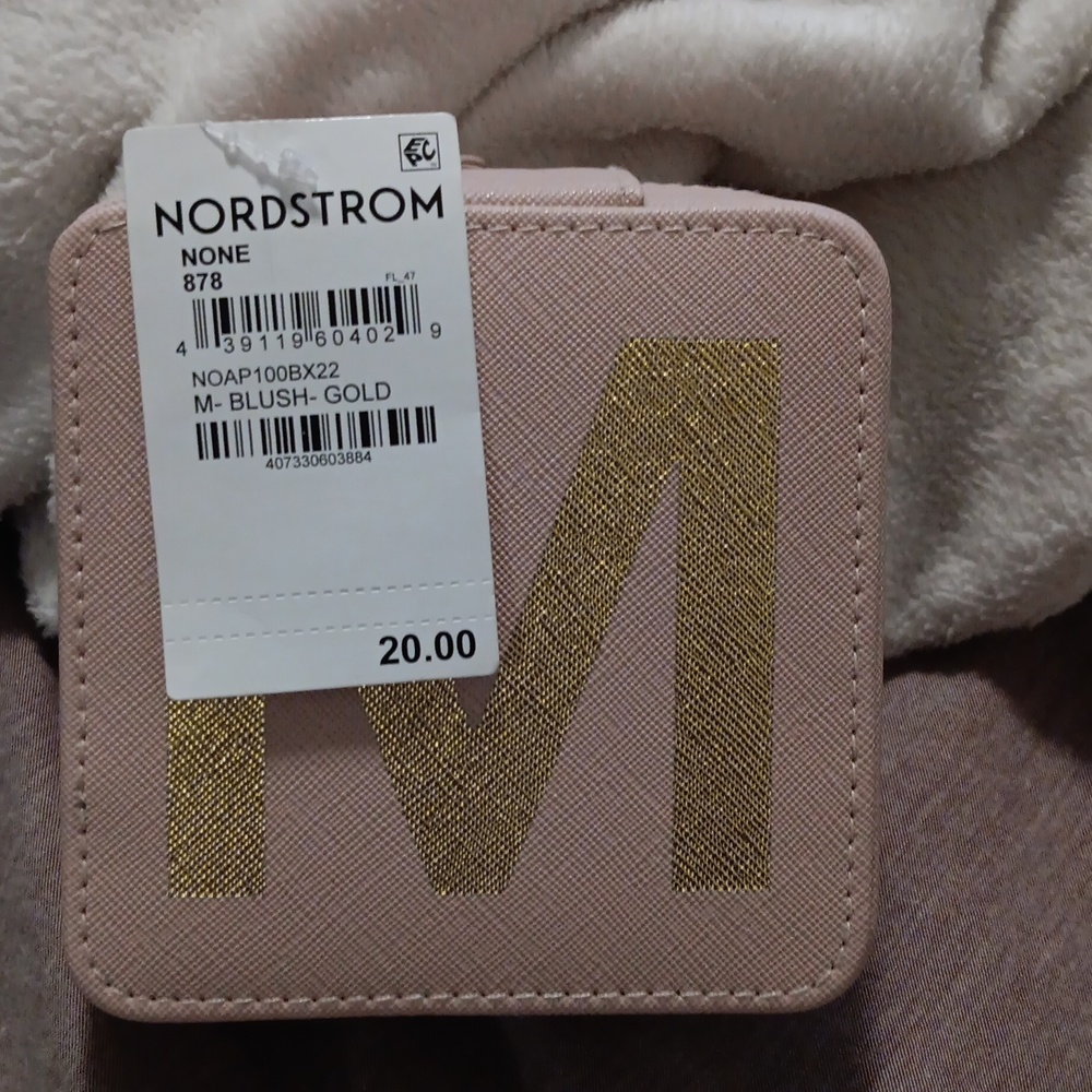 Nordstrom jewelry box with initial M on it.